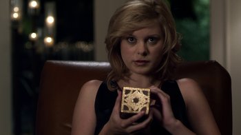 Movie still from “Hellraiser: Revelations” (2011), directed by Víctor Garcia – A woman is holding a box with a star on it; Close Up shot, Over the shoulder angle