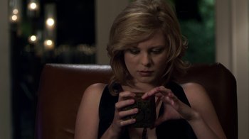 Movie still from “Hellraiser: Revelations” (2011), directed by Víctor Garcia – A beautiful woman holding onto a small box; Close Up shot, High angle