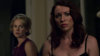 Movie still from “Hellraiser: Revelations” (2011), directed by Víctor Garcia – Two women standing next to each other in front of a wall; Close Up shot, Over the shoulder angle