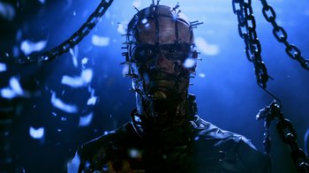 Movie still from “Hellraiser: Revelations” (2011), directed by Víctor Garcia – A person wearing a mask and chains; Close Up shot, Low angle
