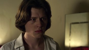 Movie still from “Hellraiser: Revelations” (2011), directed by Víctor Garcia – A person with short brown hair; Close Up shot, Over the shoulder angle