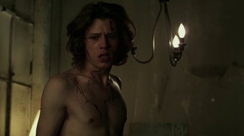 Movie still from “Hellraiser: Revelations” (2011), directed by Víctor Garcia – A man with blood on his face and chest; Medium shot, Low angle