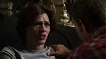 Movie still from “Hellraiser: Revelations” (2011), directed by Víctor Garcia – A man is touching a woman's face with his hand; Close Up shot, Over the shoulder angle