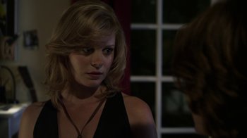 Movie still from “Hellraiser: Revelations” (2011), directed by Víctor Garcia – A woman looking at her reflection in a mirror; Close Up shot, Over the shoulder angle