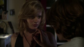 Movie still from “Hellraiser: Revelations” (2011), directed by Víctor Garcia – A woman looking in the reflection of a mirror; Close Up shot, Over the shoulder angle