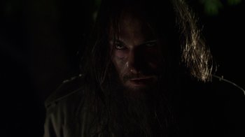 Movie still from “Hellraiser: Revelations” (2011), directed by Víctor Garcia – A person with long hair and a beard; Close Up shot, Low angle