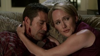 Movie still from “Hellraiser: Revelations” (2011), directed by Víctor Garcia – A man and a woman with blood all over their faces; Close Up shot, Over the shoulder angle