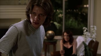 Movie still from “Hellraiser: Revelations” (2011), directed by Víctor Garcia – A man and a woman sitting in front of each other; Medium shot, Over the shoulder angle