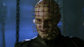 Movie still from “Hellraiser: Revelations” (2011), directed by Víctor Garcia – A person with a face covered in needles; Close Up shot, Low angle