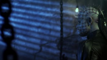 Movie still from “Hellraiser: Revelations” (2011), directed by Víctor Garcia – A chain link fence with a light shining on it; Close Up shot, Low angle