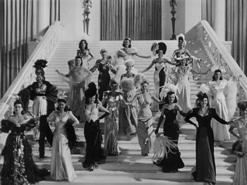 Movie still from “Hellzapoppin'” (1941), directed by H.C. Potter – A group of women standing on a set of stairs; Wide shot, High angle