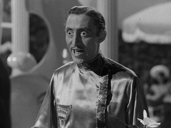 Movie still from “Hellzapoppin'” (1941), directed by H.C. Potter – An older man in a satin shirt and tie; Close Up shot, Low angle