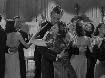Movie still from “Hellzapoppin'” (1941), directed by H.C. Potter – A man and a woman dancing in front of a group of people; Medium shot, Low angle