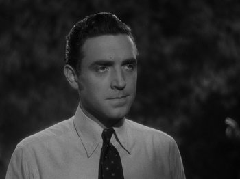 Movie still from “Hellzapoppin'” (1941), directed by H.C. Potter – Black and white photograph of a man wearing a tie; Close Up shot, Low angle
