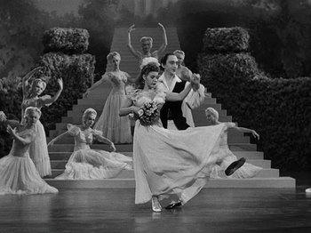 Movie still from “Hellzapoppin'” (1941), directed by H.C. Potter – A man and a woman dancing on a stage; Wide shot, High angle