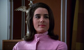 Movie still from “Help!” (1965), directed by Richard Lester – A person wearing a pink jacket; Close Up shot, Low angle