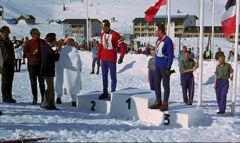 Movie still from “Help!” (1965), directed by Richard Lester – Two men standing on the top of a snow covered slope; Wide shot, Low angle