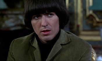 Movie still from “Help!” (1965), directed by Richard Lester – A person wearing a jacket; Close Up shot, High angle