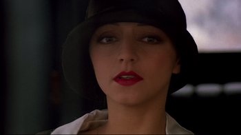 Movie still from “Henry & June” (1990), directed by Philip Kaufman – A person wearing a hat; Close Up shot, Low angle