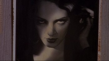 Movie still from “Henry & June” (1990), directed by Philip Kaufman – A woman's face in the dark; Close Up shot, Low angle