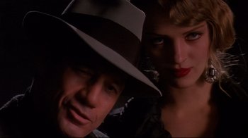 Movie still from “Henry & June” (1990), directed by Philip Kaufman – A man and a woman pose for a picture; Close Up shot, Low angle