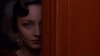 Movie still from “Henry & June” (1990), directed by Philip Kaufman – A person standing in front of a door; Close Up shot, Overhead angle