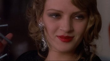 Movie still from “Henry & June” (1990), directed by Philip Kaufman – A person wearing a necklace; Close Up shot, Over the shoulder angle