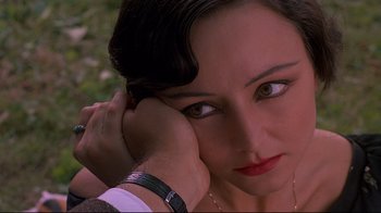 Movie still from “Henry & June” (1990), directed by Philip Kaufman – A person holding their hand up to their face; Close Up shot, High angle