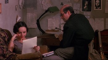 Movie still from “Henry & June” (1990), directed by Philip Kaufman – A man and a woman sitting in a room; Medium shot, Over the shoulder angle
