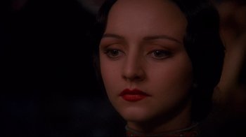 Movie still from “Henry & June” (1990), directed by Philip Kaufman – A person wearing makeup; Close Up shot, Over the shoulder angle