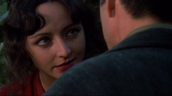 Movie still from “Henry & June” (1990), directed by Philip Kaufman – A man and a woman looking at one another; Close Up shot, Over the shoulder angle
