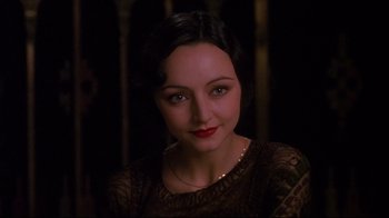 Movie still from “Henry & June” (1990), directed by Philip Kaufman – A person wearing a dress; Close Up shot, Over the shoulder angle