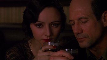 Movie still from “Henry & June” (1990), directed by Philip Kaufman – A man and a woman holding a glass of wine; Close Up shot, Low angle