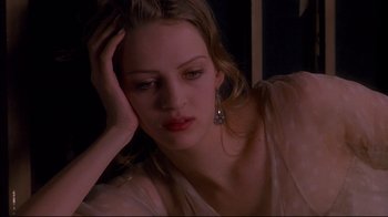 Movie still from “Henry & June” (1990), directed by Philip Kaufman – A beautiful young lady sitting in front of a mirror; Close Up shot, High angle