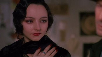 Movie still from “Henry & June” (1990), directed by Philip Kaufman – A person wearing a ring; Close Up shot, Over the shoulder angle