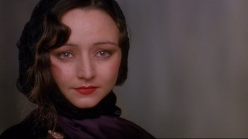 Movie still from “Henry & June” (1990), directed by Philip Kaufman – A person wearing a scarf; Close Up shot, Over the shoulder angle