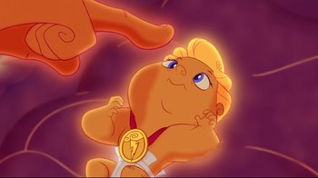 Movie still from “Hercules” (1997), directed by Ron Clements – An image of an animated character with a gold medal on his chest; Close Up shot, Overhead angle