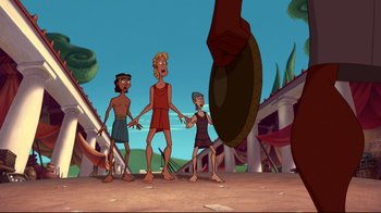 Movie still from “Hercules” (1997), directed by Ron Clements – A group of people standing next to each other on a field; Wide shot, Over the shoulder angle