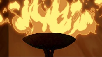 Movie still from “Hercules” (1997), directed by Ron Clements – A table with a fire background in the background; Extreme Close Up shot, High angle