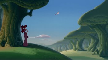 Movie still from “Hercules” (1997), directed by Ron Clements – A woman standing on top of a green hill; Extreme Wide shot, Low angle