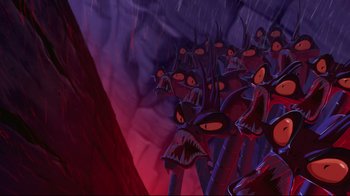 Movie still from “Hercules” (1997), directed by Ron Clements – A bunch of evil looking creatures in a cave; Wide shot, High angle