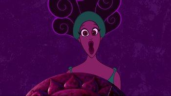 Movie still from “Hercules” (1997), directed by Ron Clements – A woman in a green dress with a purple head piece; Close Up shot, Low angle