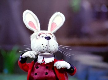 Movie still from “Here Comes Peter Cottontail” (1971), directed by Jules Bass – A stuffed rabbit wearing a red jacket and a white shirt; Close Up shot, Low angle