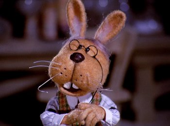 Movie still from “Here Comes Peter Cottontail” (1971), directed by Jules Bass – A stuffed animal wearing glasses; Close Up shot, High angle