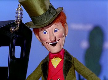 Movie still from “Here Comes Peter Cottontail” (1971), directed by Jules Bass – The head of a doll wearing a top - hat; Close Up shot, Low angle