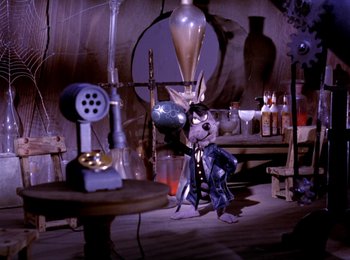 Movie still from “Here Comes Peter Cottontail” (1971), directed by Jules Bass – A cat standing next to a phone in a dimly - lit room; Wide shot, High angle