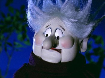 Movie still from “Here Comes Peter Cottontail” (1971), directed by Jules Bass – The face of a doll with white hair; Close Up shot, Low angle