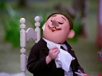 Movie still from “Here Comes Peter Cottontail” (1971), directed by Jules Bass – A cartoon character holding a paper towel; Close Up shot, Low angle