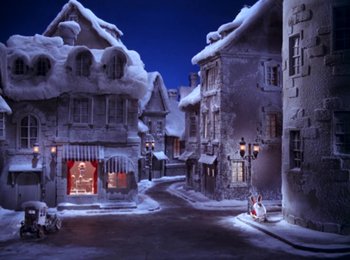 Movie still from “Here Comes Peter Cottontail” (1971), directed by Jules Bass – A snowy street scene with buildings and a street light; Extreme Wide shot, High angle