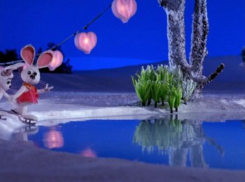 Movie still from “Here Comes Peter Cottontail” (1971), directed by Jules Bass – A rabbit is standing next to a tree; Wide shot, High angle